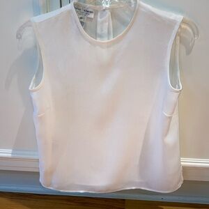 Petite white shell. Rena Rowan.